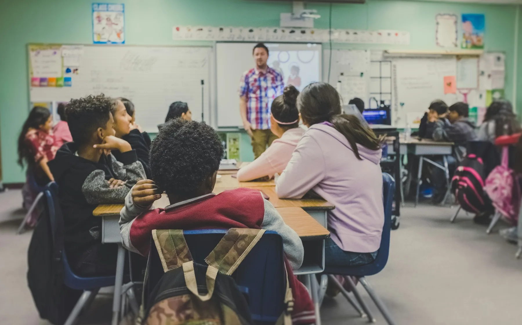 Students listening during a classroom presentation
