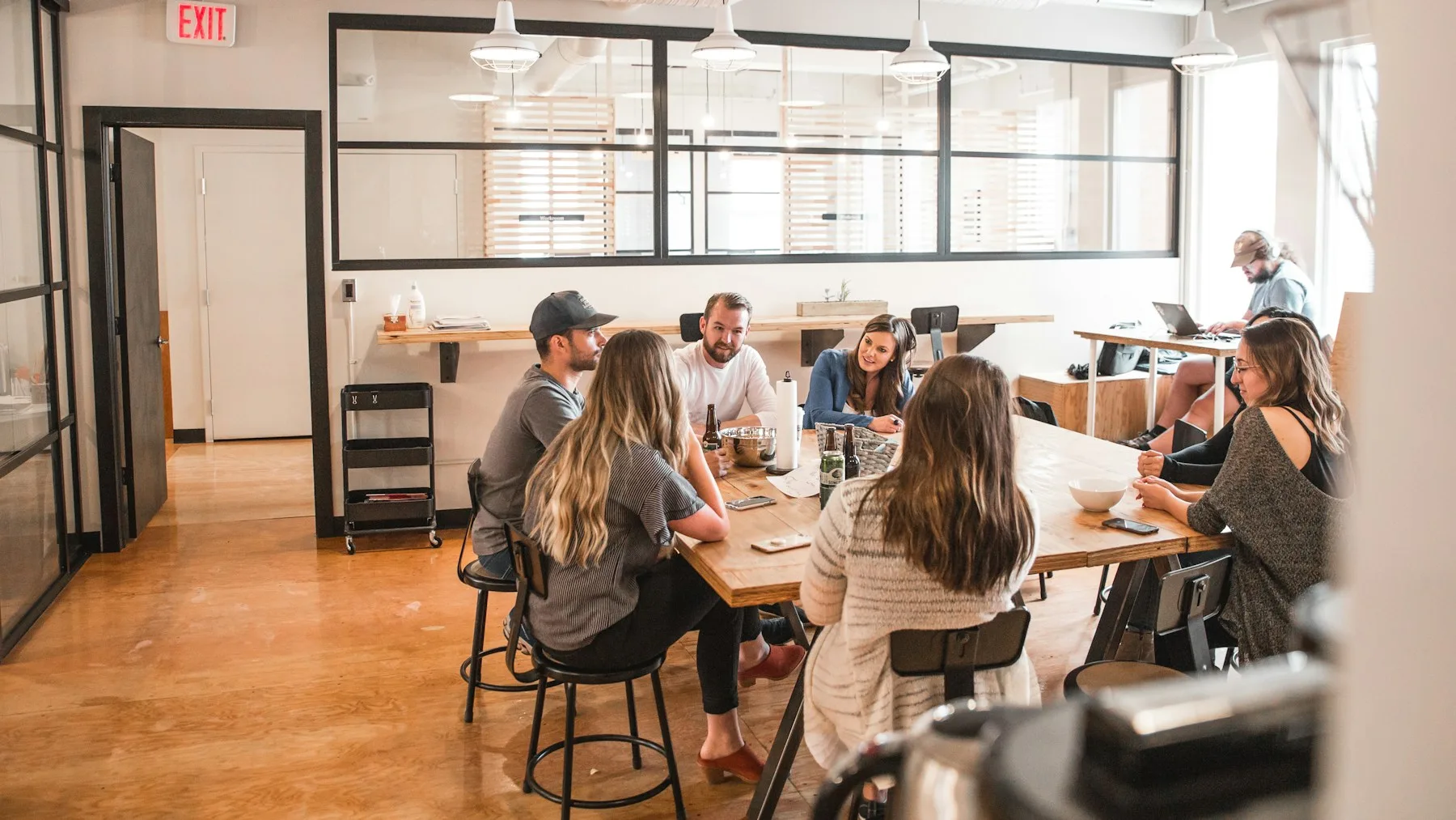A group gathered around a table in conversation