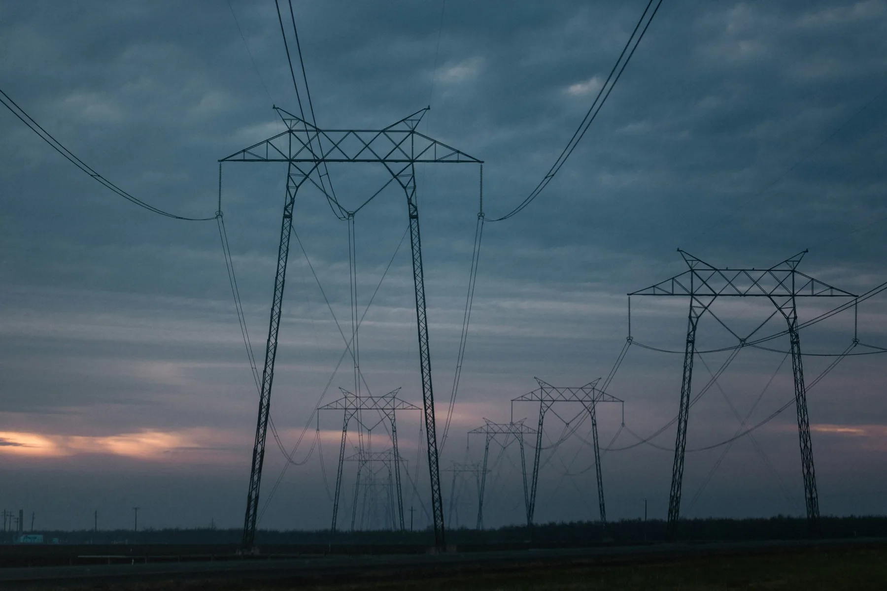 Electrical transmission towers at dusk